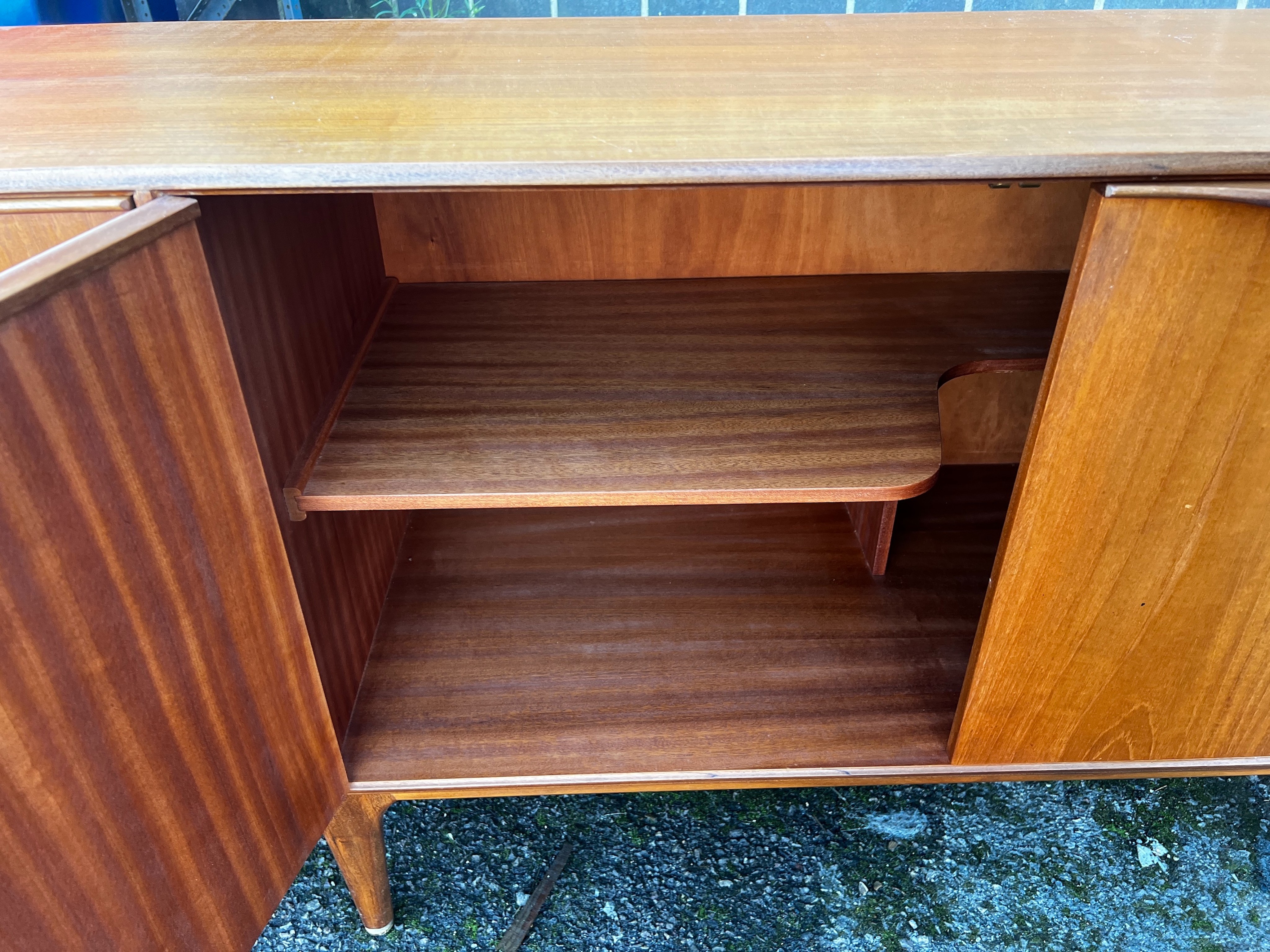 A. H. McIntosh & Co. A Dunvegan teak sideboard designed by Tom Robertson, length 201cm, depth 48cm, height 76cm